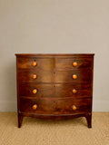 Antique bow front mahogany chest of drawers with original wooden handles 