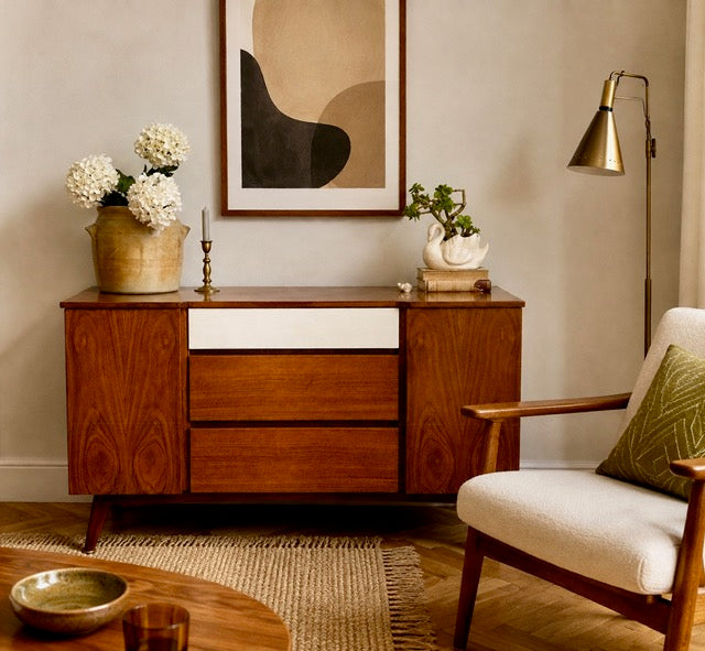 Vintage mid century sideboard styled in a living room 