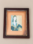 Vintage print of Modigliani depicting Jeanne in a blue dress and ochre scarf, displayed in a dark wooden frame with metallic inner boarder and aged ochre mount 